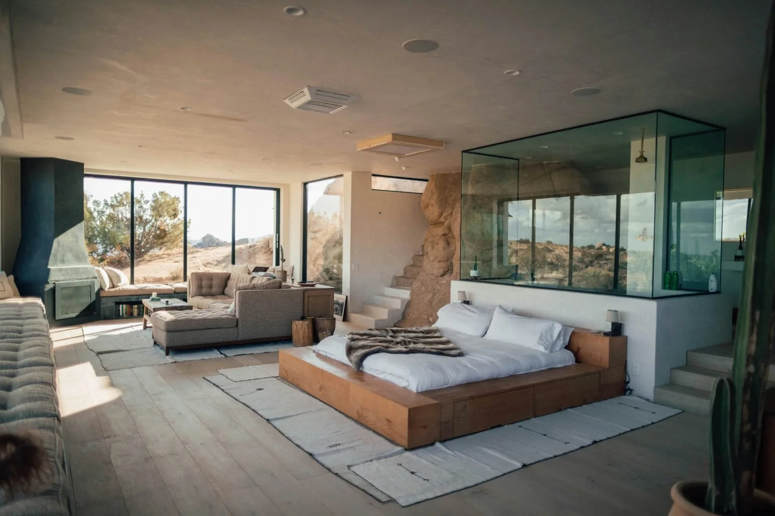 Open-plan villa bedroom prepared for a guest arrival